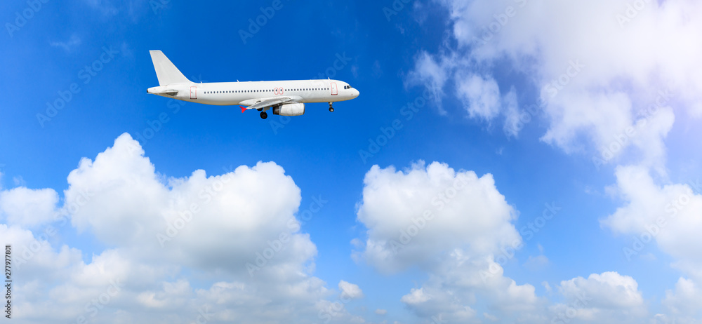Commercial airplane flying in the blue sky Commercial airplane flying in the blue sky