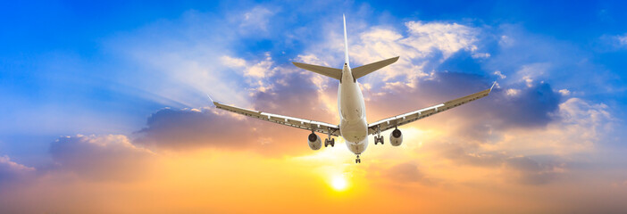 Airplane in the sky at sunrise