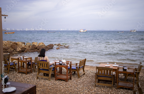 outdoor cafe on the beach © Peerapol