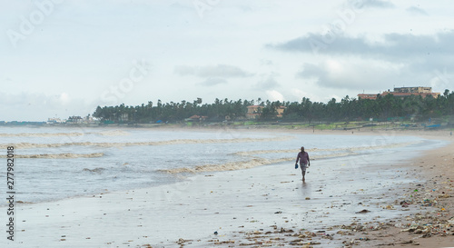 man walking on beach