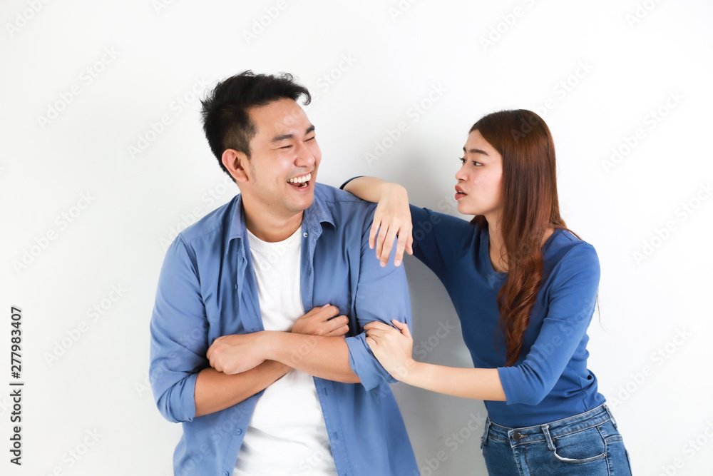 Asian couple in blue shirt on white background happy and smile mood Asian couple in blue shirt on white background happy and smile mood