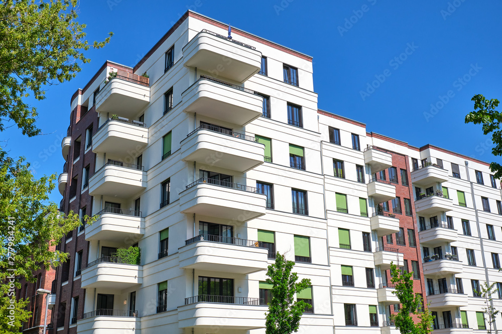 Modern white multi-family apartment house seen in Berlin, Germany
