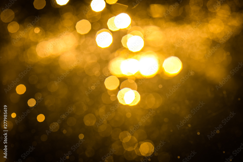 Obraz premium Abstract gold bokeh with black