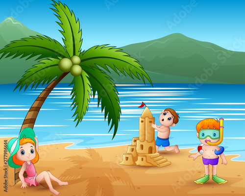Children making sand castle at tropical beach