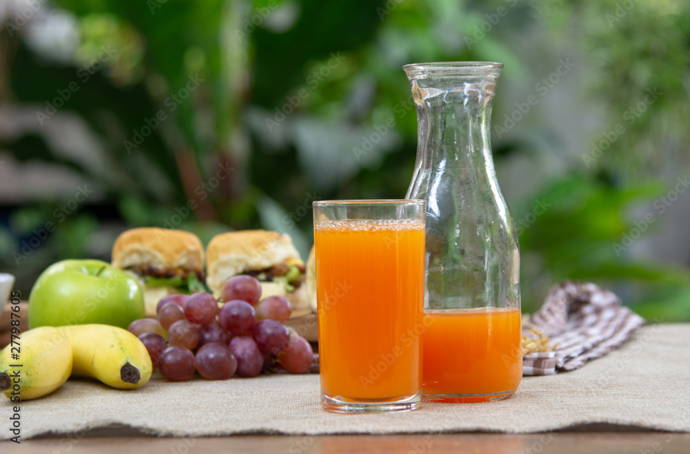 Fototapeta premium Orange juice with breakfast on the table