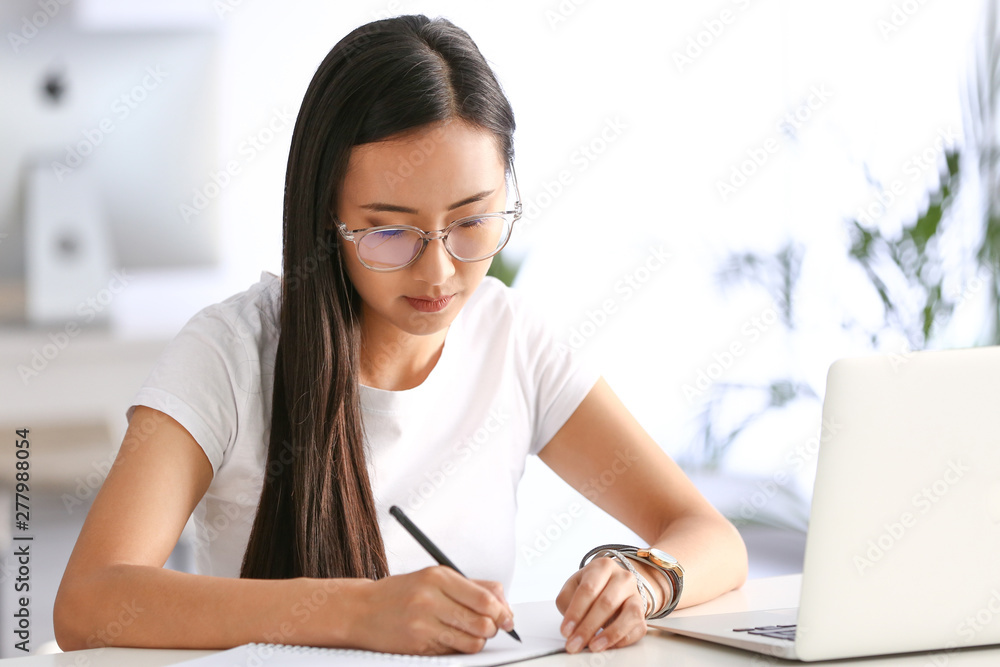 Young Asian student preparing for exam in university Young Asian student preparing for exam in university