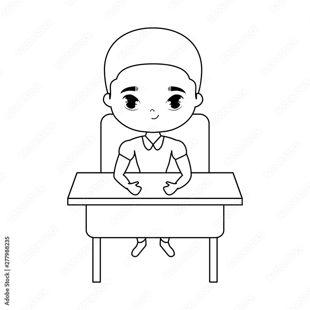 little student boy sitting in school desk