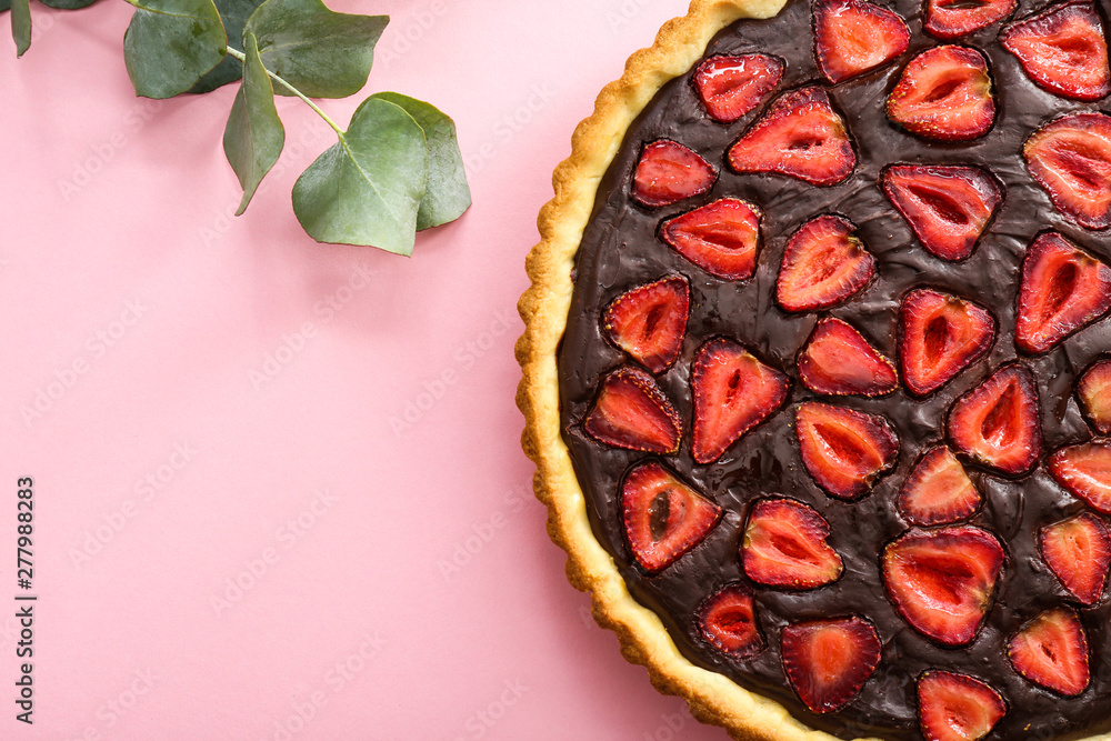 Tasty chocolate cake with strawberry on color background Tasty chocolate cake with strawberry on color background