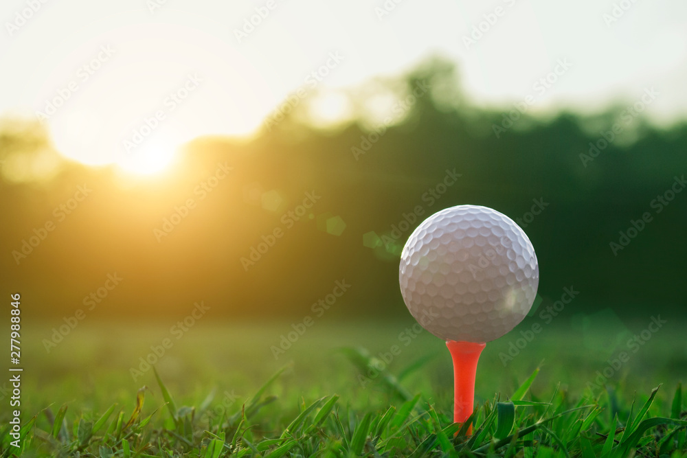 golf ball on tee in a beautiful golf course with morning sunshine golf ball on tee in a beautiful golf course with morning sunshine
