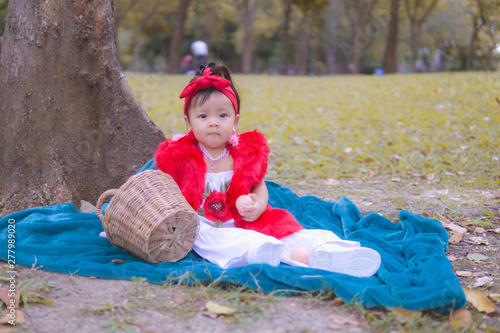 portrait of a girl. Happy little girl in autumn park. Fashion Kid outdoor. © Shubby Studio