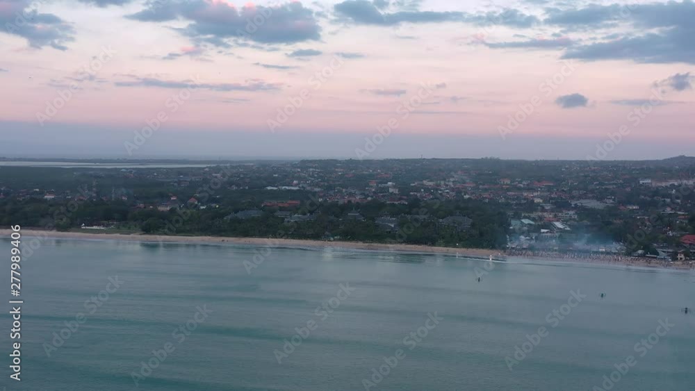 Beautiful Sunset on Jimbaran beach on Bali island. Aerial video from the drone. Beautiful Sunset on Jimbaran beach on Bali island. Aerial video from the drone.