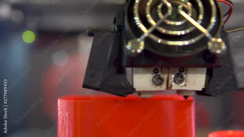 3D printer working. Automatic 3D printer printing an object from plastic. 3D printer working. Automatic 3D printer printing an object from plastic.