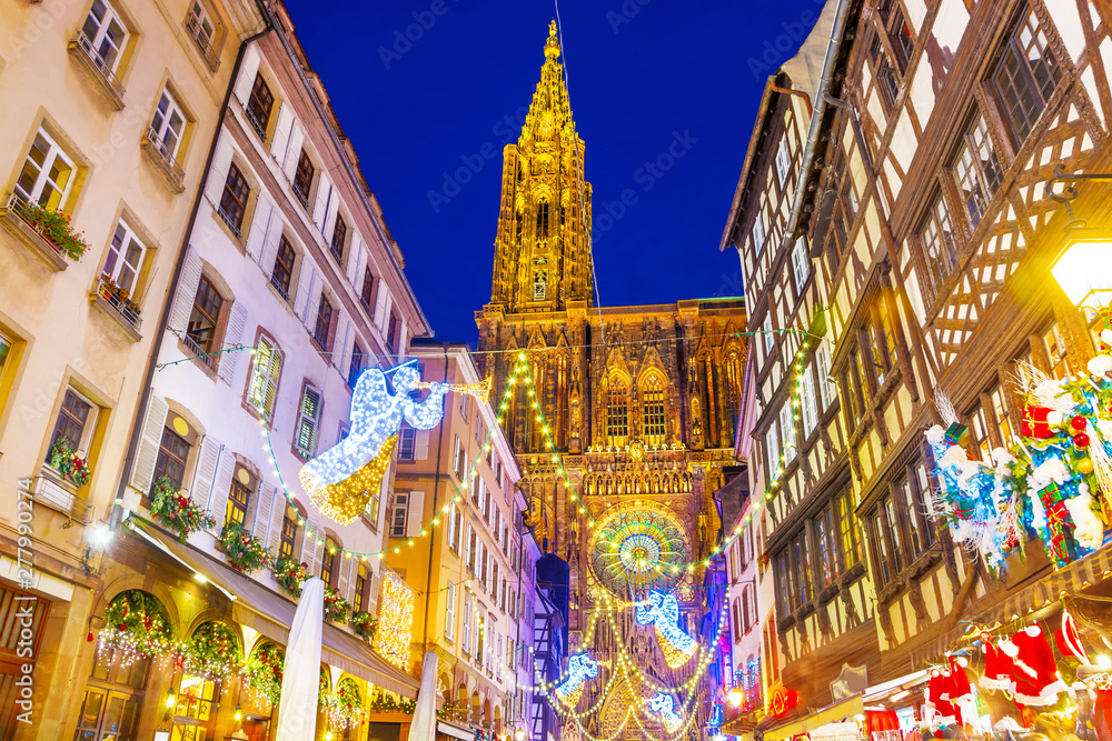 Festive Christmas illumination and decorations on streets of Strasbourg - capital of Christmas, Alsace, France. - obrazy, fototapety, plakaty 