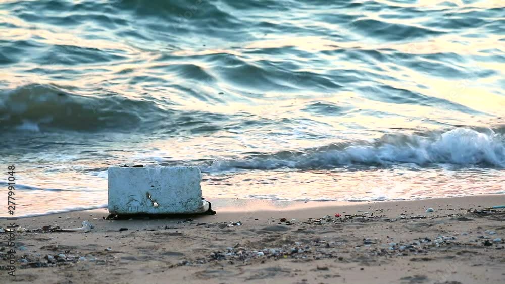 sunset on sea with foamand waste are left on the beach and the waves blew them into the sea1 sunset on sea with foamand waste are left on the beach and the waves blew them into the sea1