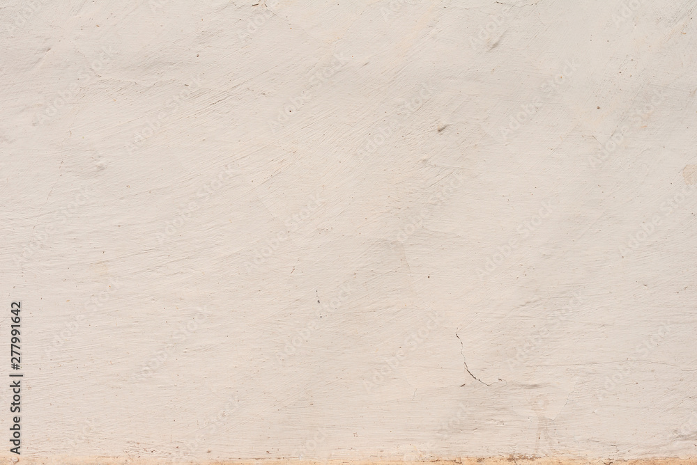 Texture of a concrete wall with cracks and scratches which can be used as a background