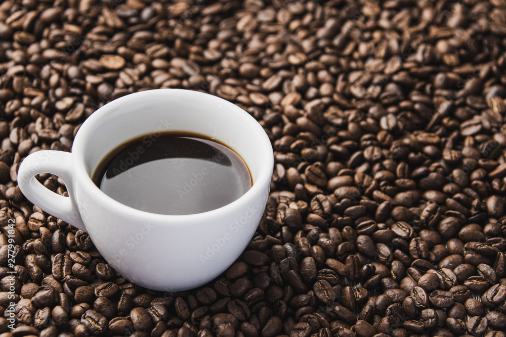 cup of coffee with beans background cup of coffee with beans background