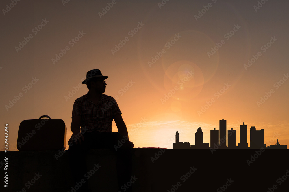 Traveler in front of Detroit city skyline