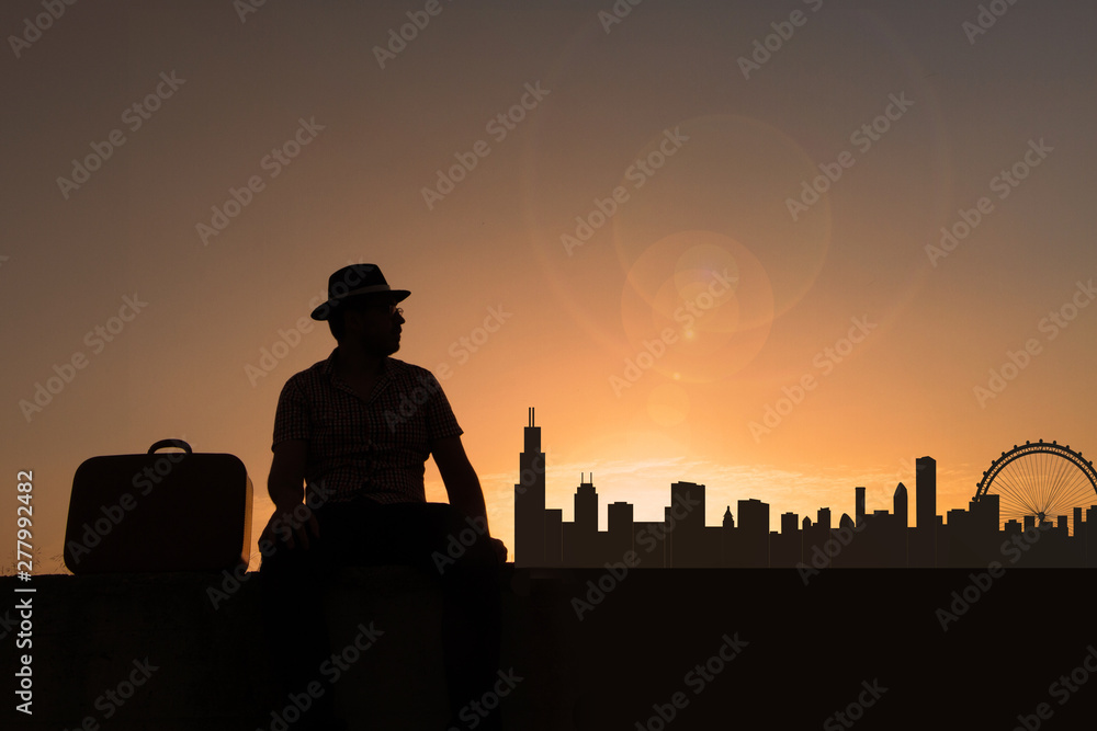 Traveler with suitcase and hat in front of city skyline of chicago in united states