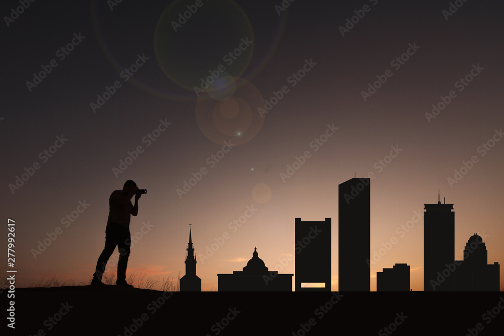 Traveler facing the skyline of the city of Boston in the United States