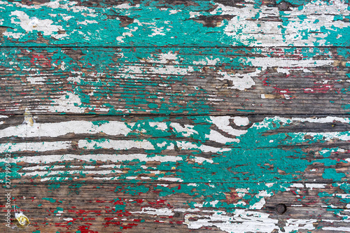 old multicolored wooden boards. Rubbed paint of different colors on a wooden surface. abstract grunge wood texture background