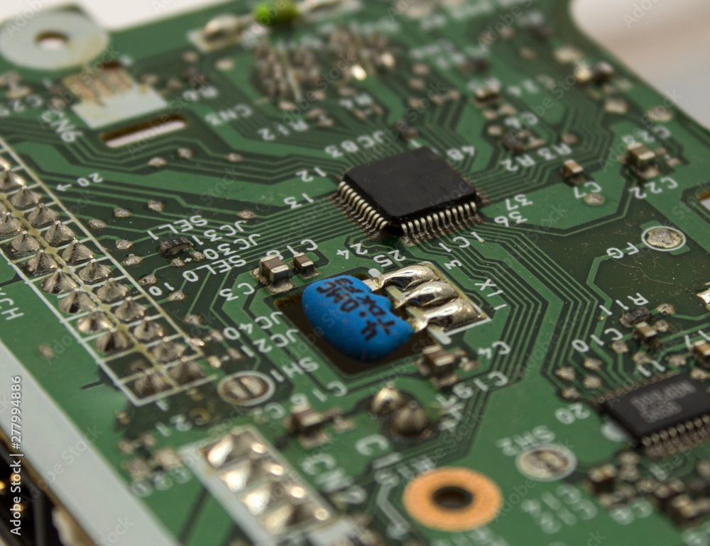 black little chip on green system board close up black little chip on green system board close up