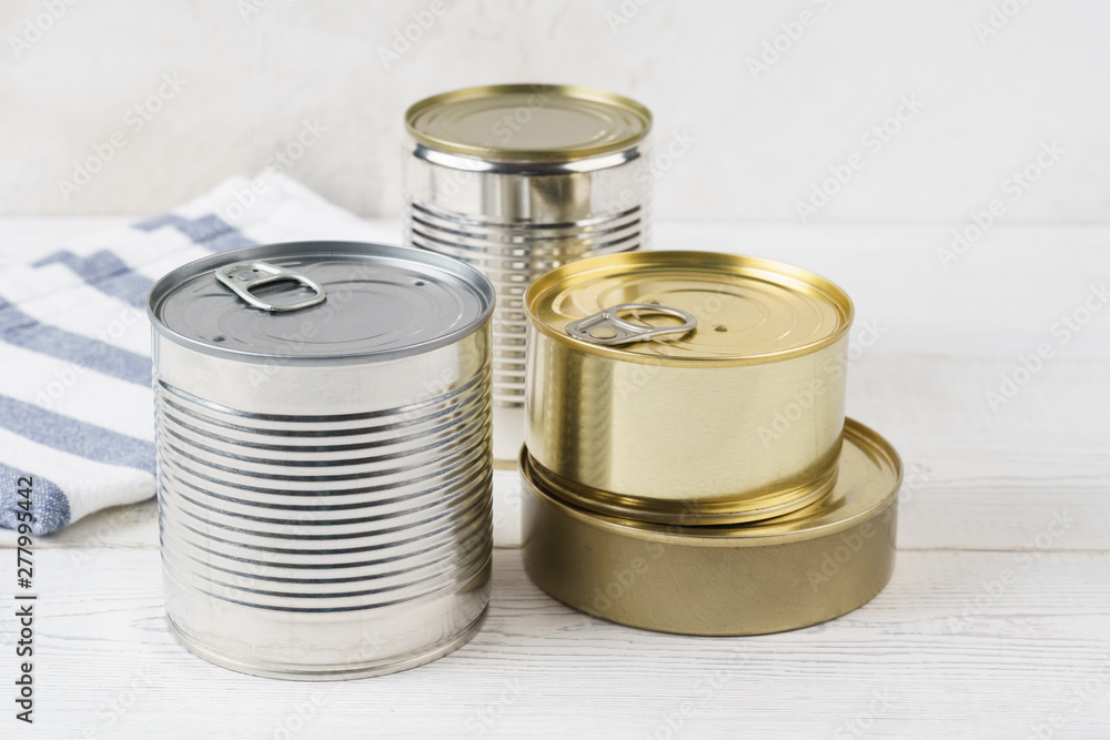 Various closed tin cans with food preserves. Various closed tin cans with food preserves.
