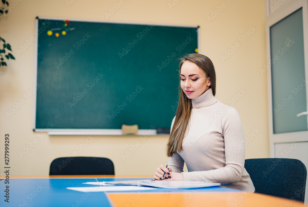 Teacher in classroom. Education. Job. People concept. Educational theme. Professor educates students. Progressive school. Teacher in classroom. Education. Job. People concept. Educational theme. Professor educates students. Progressive school.