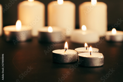 Candles Burning at Night. White Candles Burning in the Dark