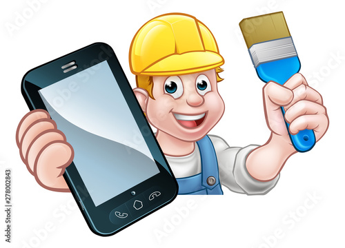 A painter decorator or handyman holding a paintbrush and phone with copyspace