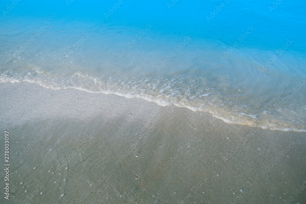 Wave of water splash on the sea beach