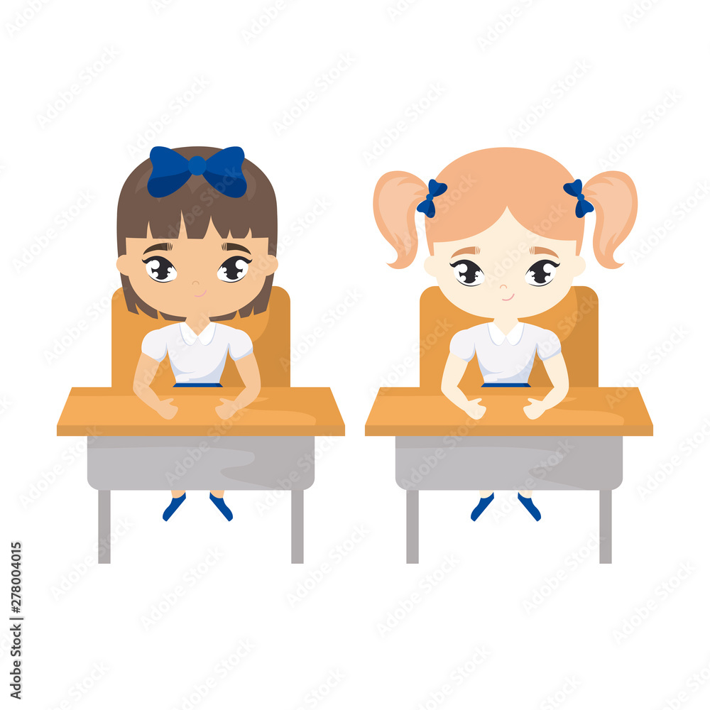 little student girls seated in school desks little student girls seated in school desks