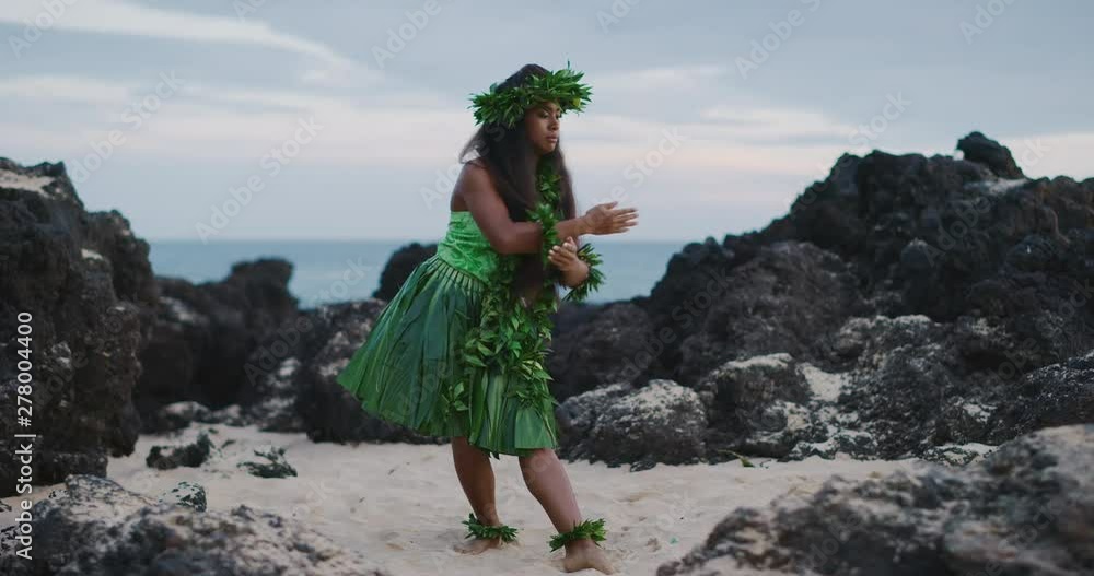 Traditional Hawaiian hula dancing at sunset in slow motion, woman ...
