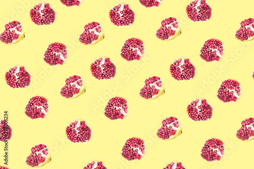 Fruit pattern of Pomegranates on yellow background.