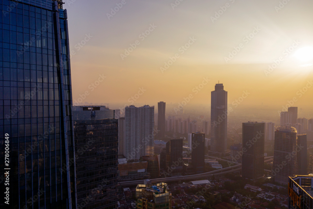 Jakarta cityscape with high buildings at dawn time