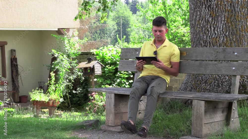 A young teenager with a tablet computer chatting. A young teenager with a tablet computer chatting.