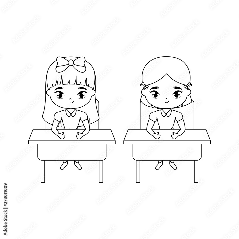 little student girls seated in school desks little student girls seated in school desks
