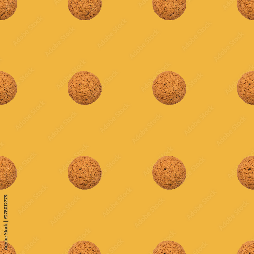 Seamless repeating yellow pattern of cookies