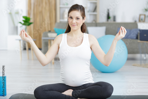 pregnant woman during yoga position