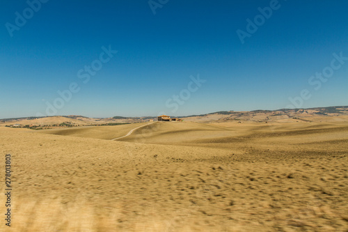 panorama of Tuscan countryside with blue sky Italy