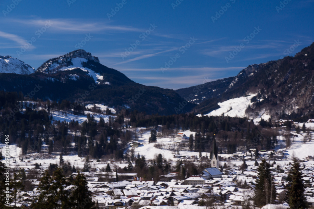german alps mountain top in winter sky