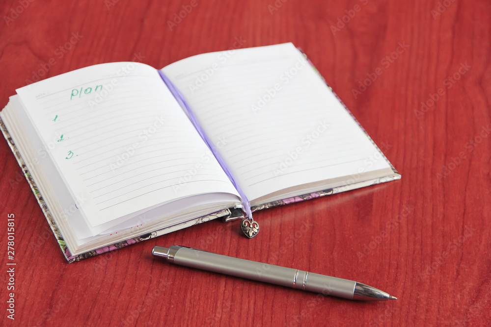 Notebook for business and notes with white pages and pencil, penster Notebook for business and notes with white pages and pencil, penster