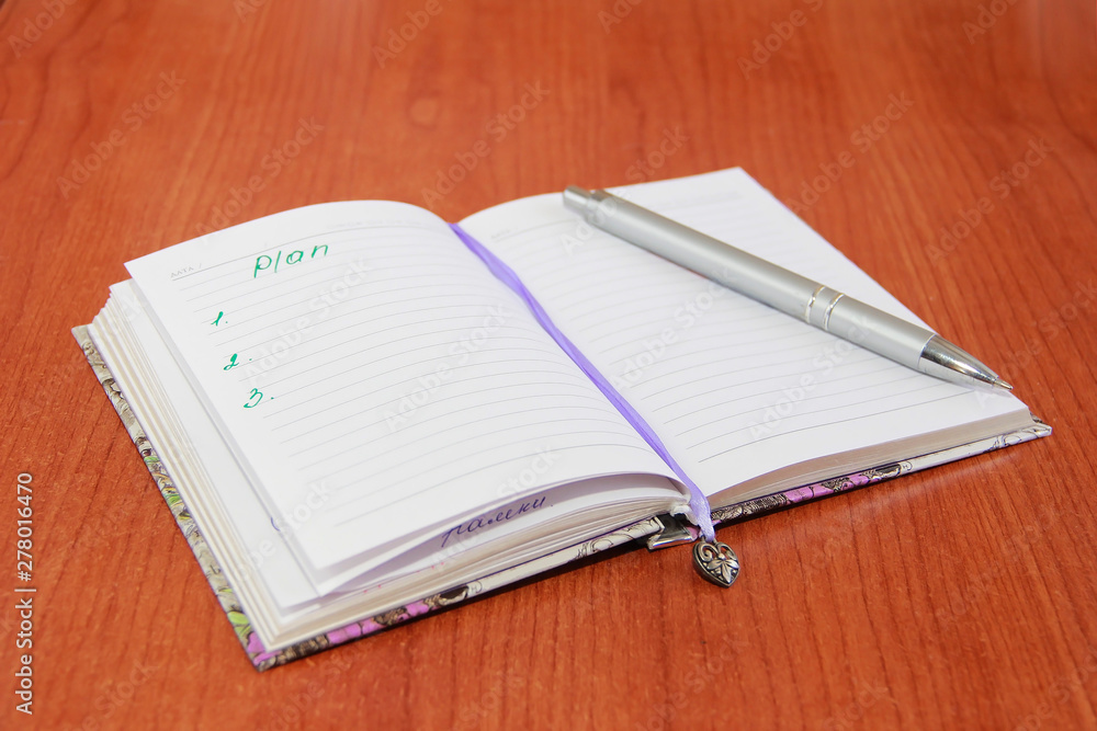 Notebook for business and notes with white pages and pencil, penster Notebook for business and notes with white pages and pencil, penster