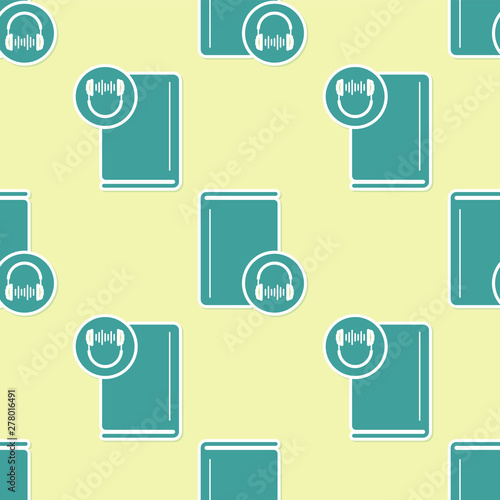 Green Audio book icon isolated seamless pattern on yellow background. Book with headphones. Audio guide sign. Online learning concept. Vector Illustration