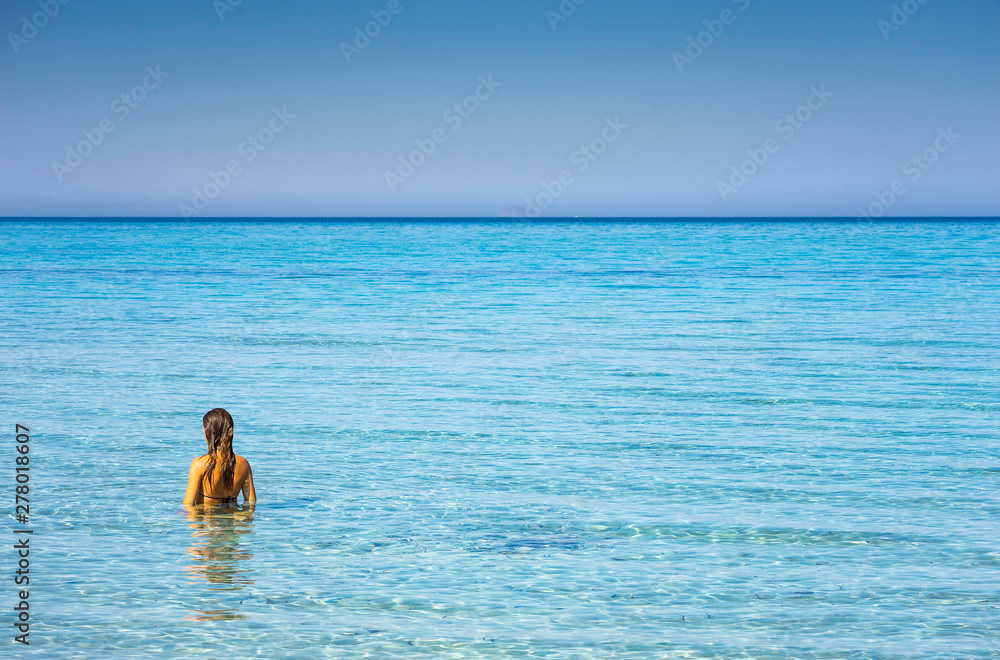 young woman in the clear water of the Sardinia young woman in the clear water of the Sardinia