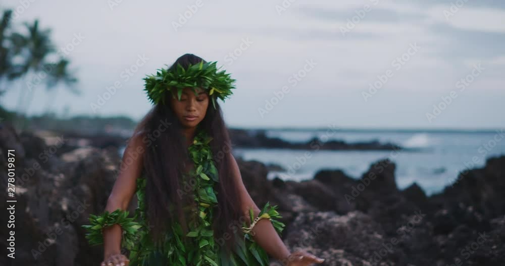 Traditional Hawaiian hula dancing at sunset in slow motion, woman ...