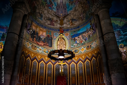 The beauty of the Temple of the Sacred Heart in Barcelona.Temple of the Sacred Heart wall paintings. Icons and the story of the beginning of life.