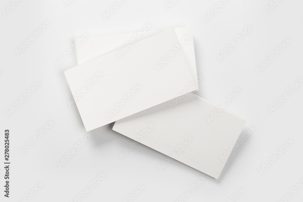 Mockup of business cards stack at white textured background. Design concept. Template for branding identity. Mockup of business cards stack at white textured background. Design concept. Template for branding identity.