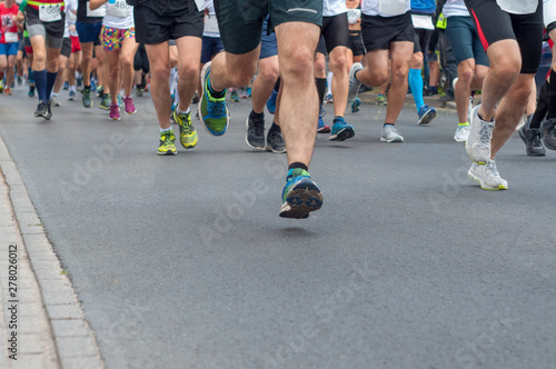 Legs group runners running on asphalt road. Selective focus. © Sentemon 
