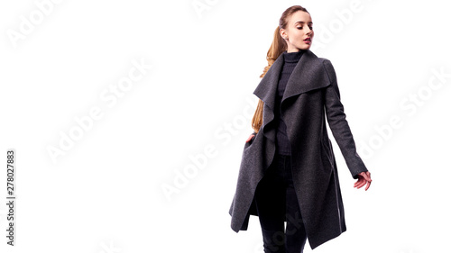 Isolated studio shot, stylish clothes, fashion, spring autumn. Young woman elegant in fashionable coat