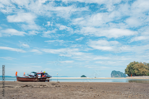 Fototapeta Naklejka Na Ścianę i Meble -  Long Tail Boat on tropical sand beach, Andaman Sea, in Thailand